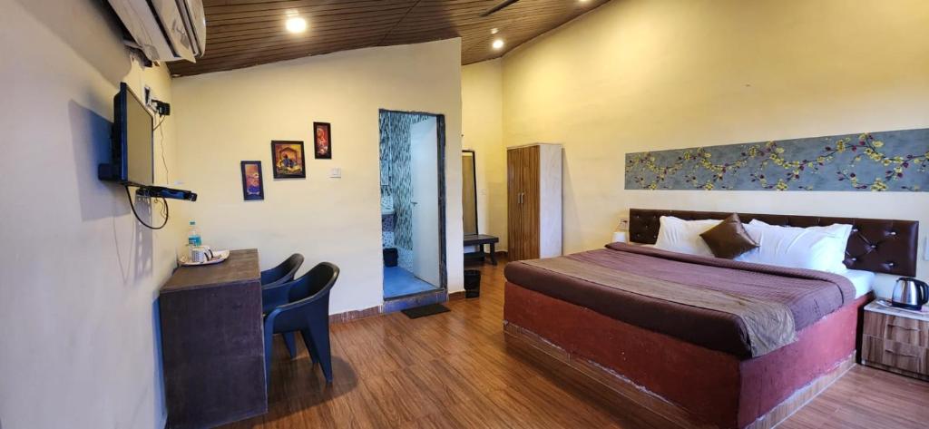 Postel nebo postele na pokoji v ubytování Mysticstays Resort