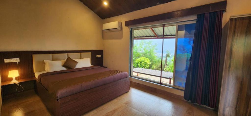 Postel nebo postele na pokoji v ubytování Mysticstays Resort
