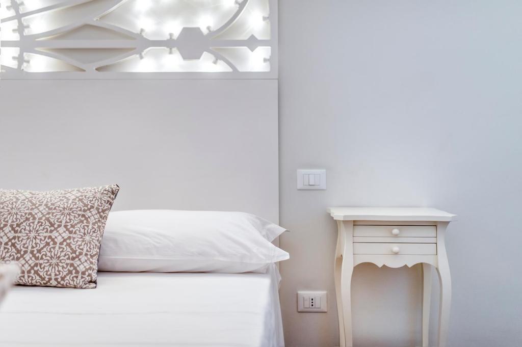 Postel nebo postele na pokoji v ubytování Vittoria Luxury House