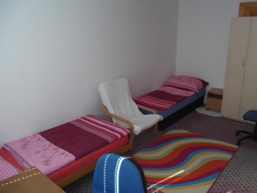 Postel nebo postele na pokoji v ubytování Penzion Apartmány Zlín