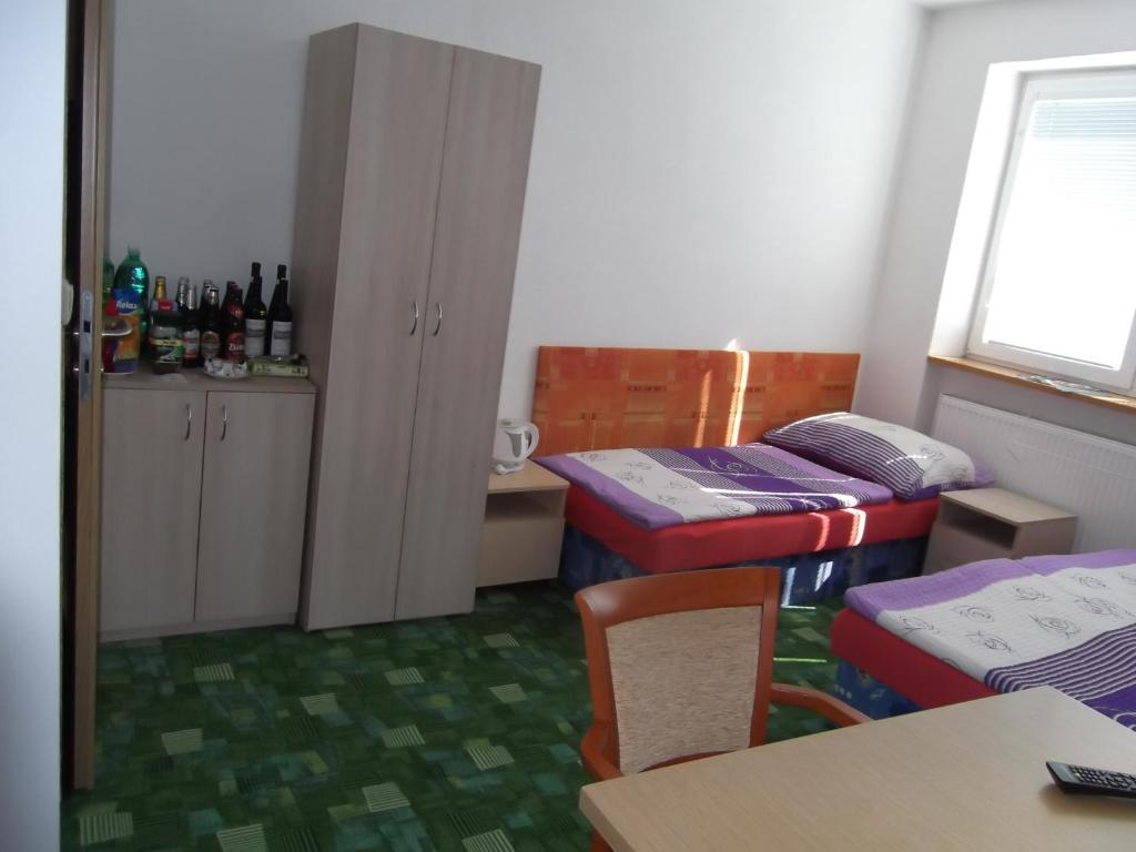 Postel nebo postele na pokoji v ubytování Penzion Apartmány Zlín