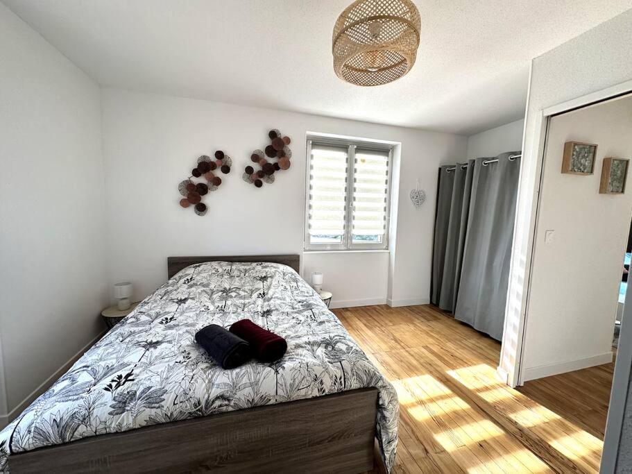 Postel nebo postele na pokoji v ubytování Gîte Le Bredala