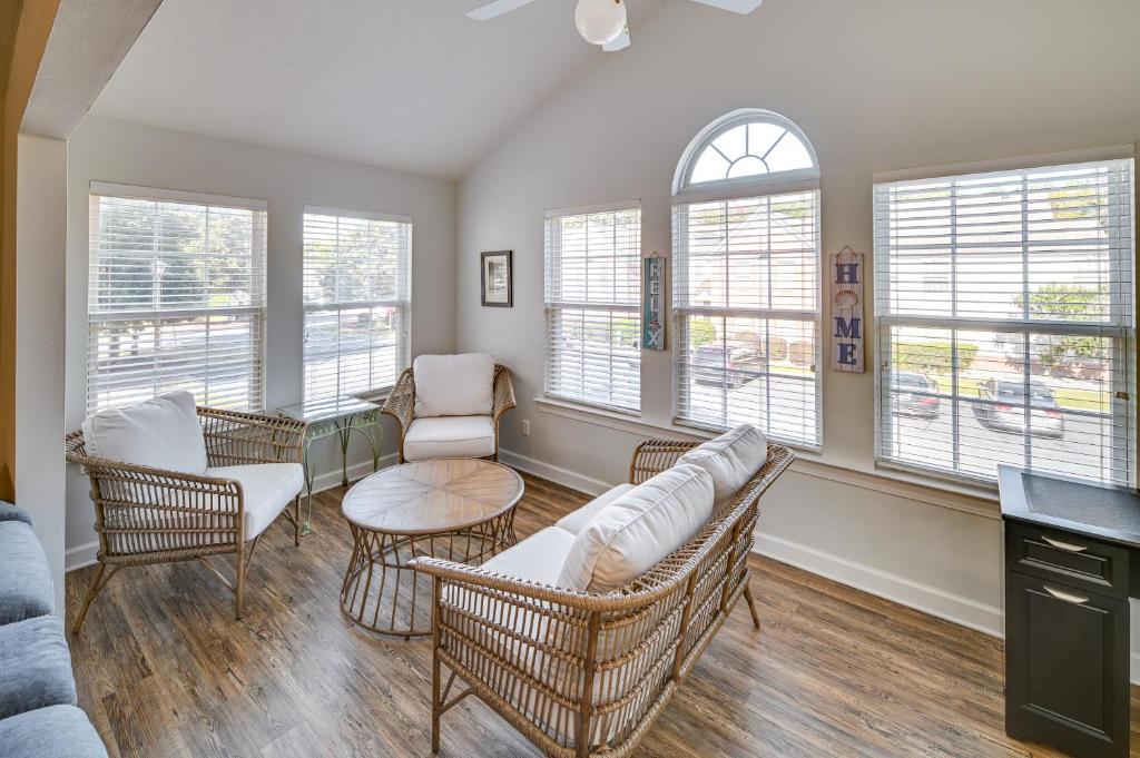 a living room with a couch and chairs and windows at Murrells Inlet Vacation Rental about 4 Mi to the Beach in Myrtle Beach