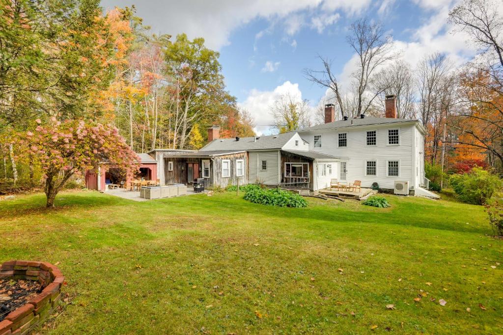 a large white house with a yard at Historic Home with Modern Updates on Less Than 4 Acres 