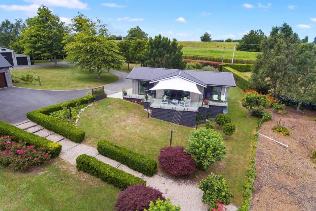 an aerial view of a house with a garden at Hobbiton Countryside Sanctuary in Matamata