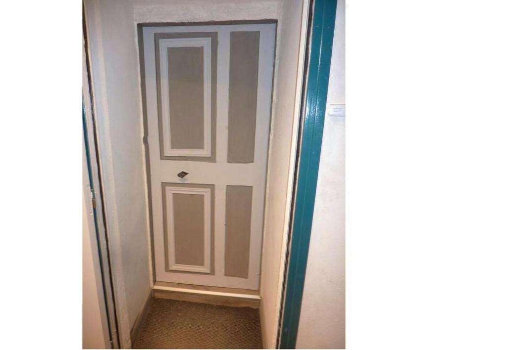a door in a room with a corridor at Appartement d&#39;une chambre avec vue sur la ville et wifi a Embrun in Embrun