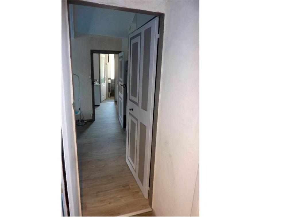 a hallway with a mirror in a room at Appartement d&#39;une chambre avec vue sur la ville et wifi a Embrun in Embrun