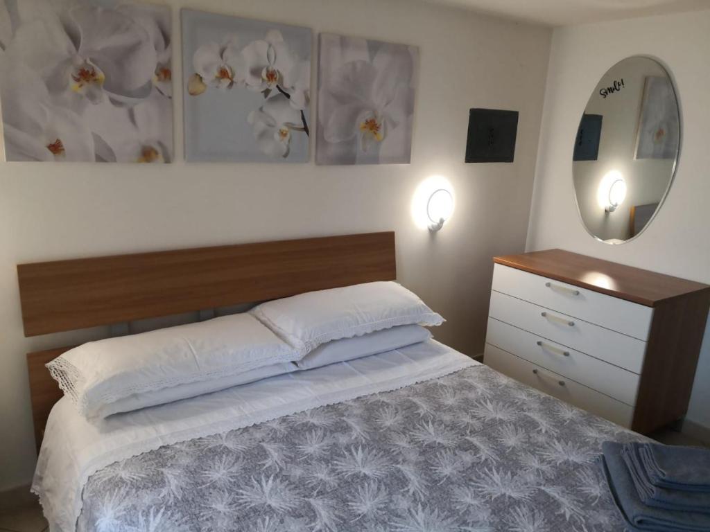 Postel nebo postele na pokoji v ubytování Casetta a Monte Sant'á