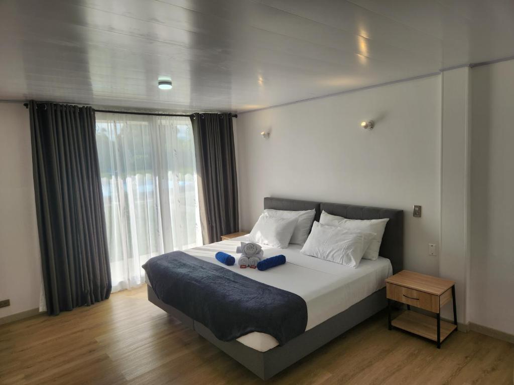 Ένα ή περισσότερα κρεβάτια σε δωμάτιο στο Hotel nelumbo