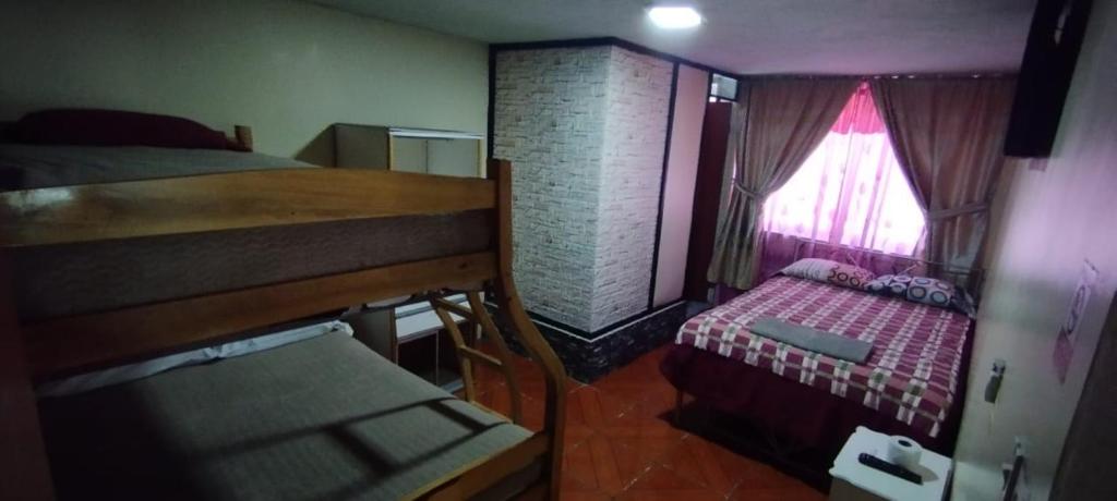 Postel nebo postele na pokoji v ubytování Hostal El Auténtico Diamante
