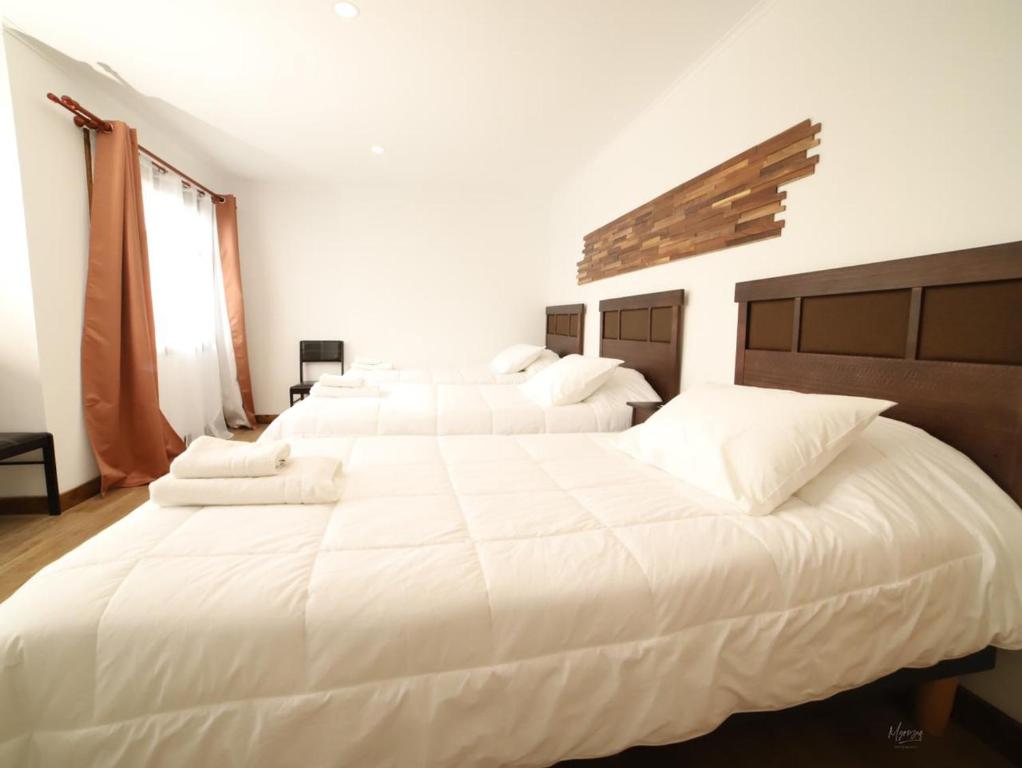 Postel nebo postele na pokoji v ubytování Hotel y Cabañas Pulegan