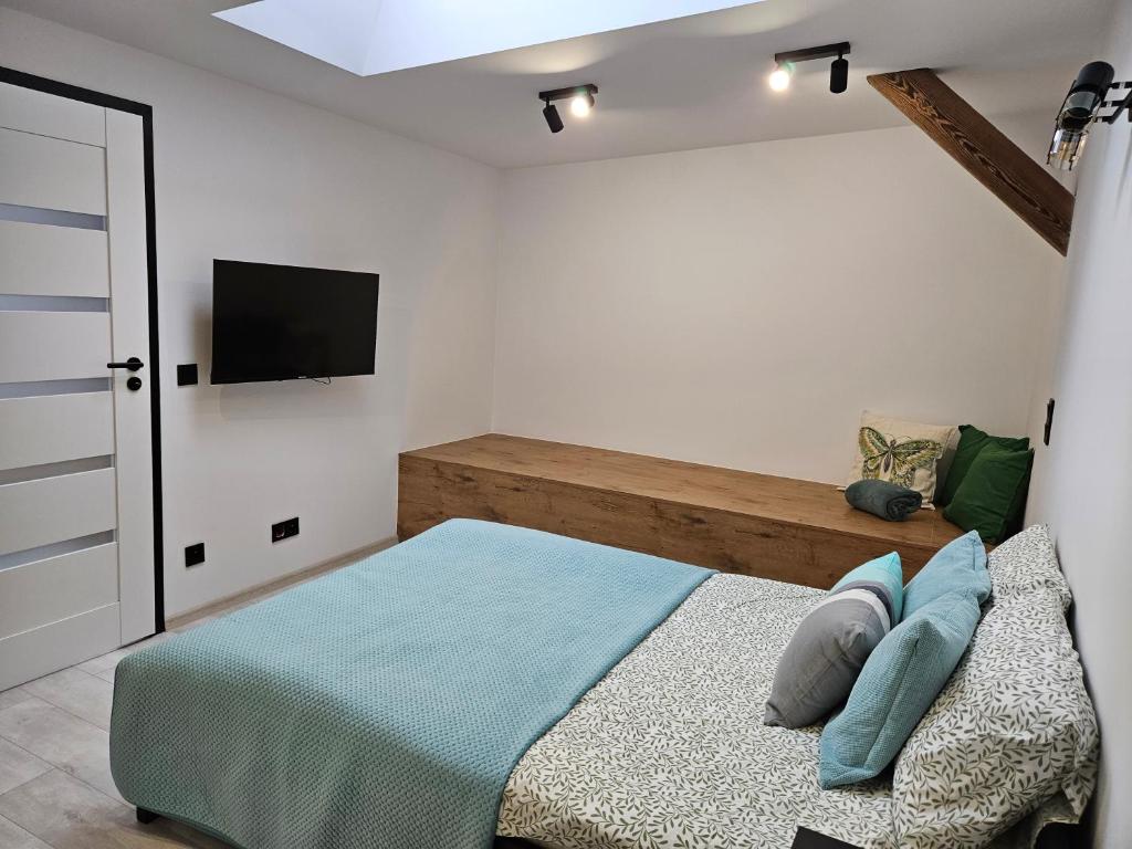 Łóżko lub łóżka w pokoju w obiekcie Ottimo Apartamenty Jagiellońska