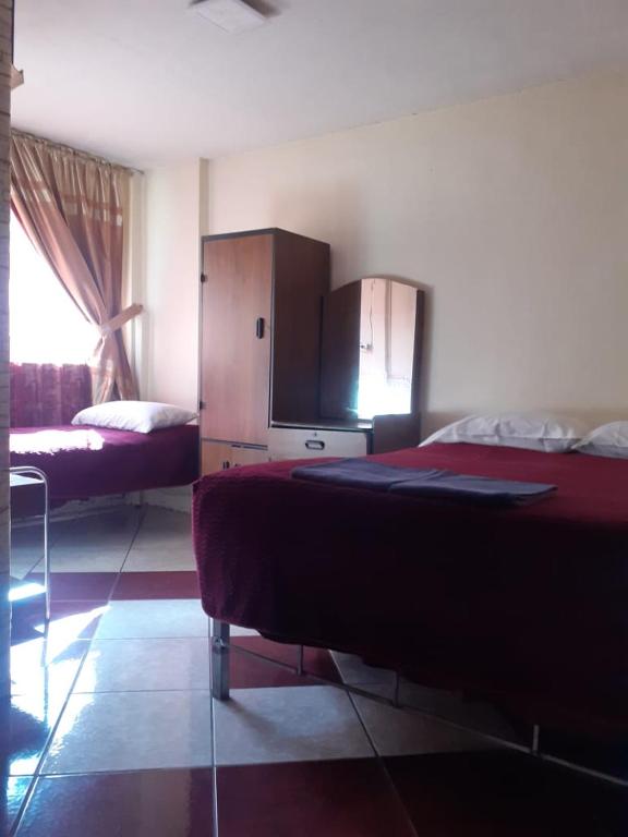 Postel nebo postele na pokoji v ubytování Hostal El Auténtico Diamante
