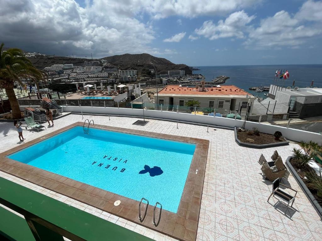 a swimming pool on the roof of a building at Apartamentos Buenavista in Puerto Rico de Gran Canaria