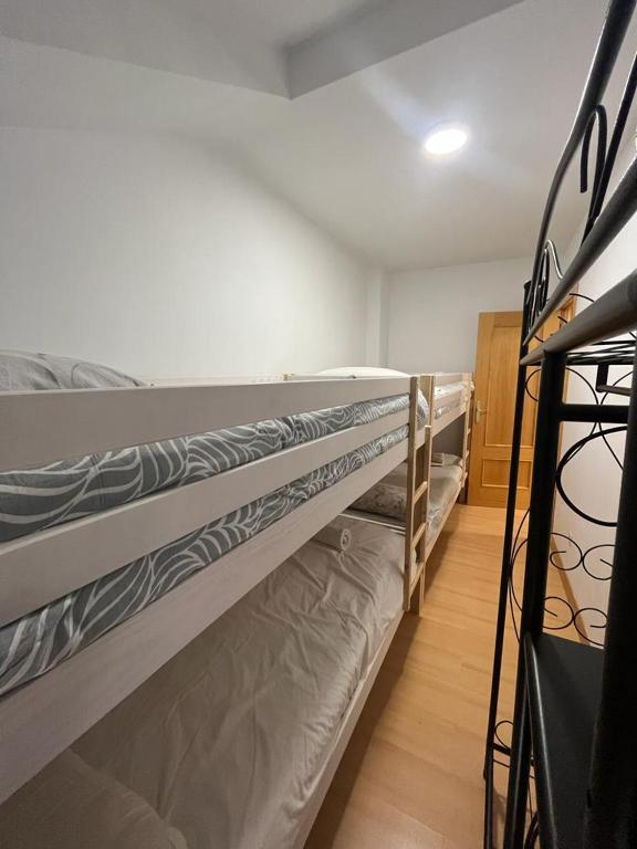 A bed or beds in a room at BUENAVISTA DELUXE
