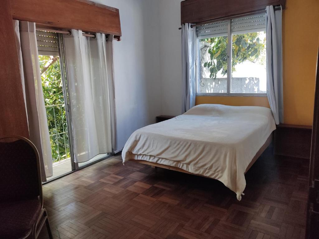 Кровать или кровати в номере Patio Urbano Suites & beds