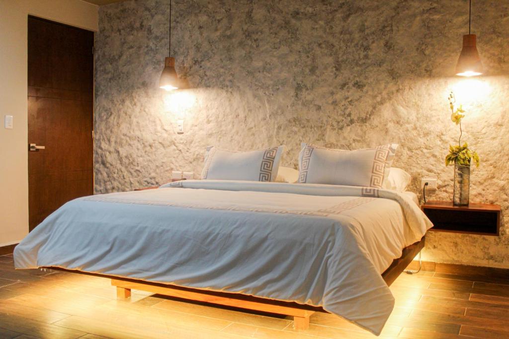 Postel nebo postele na pokoji v ubytování Hotel Scappata