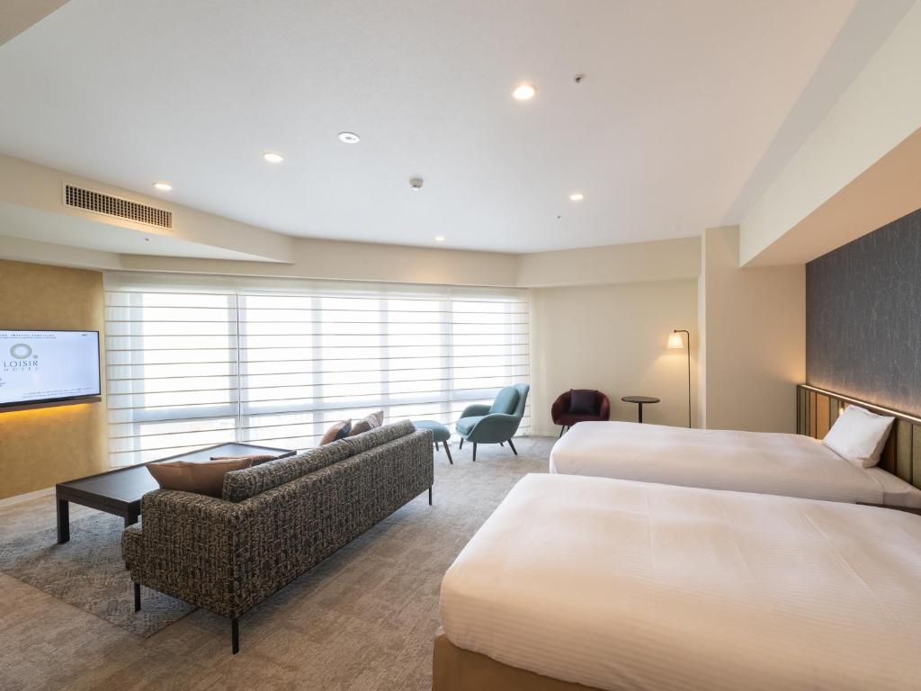 Postel nebo postele na pokoji v ubytování Loisir Hotel Kyoto Toji