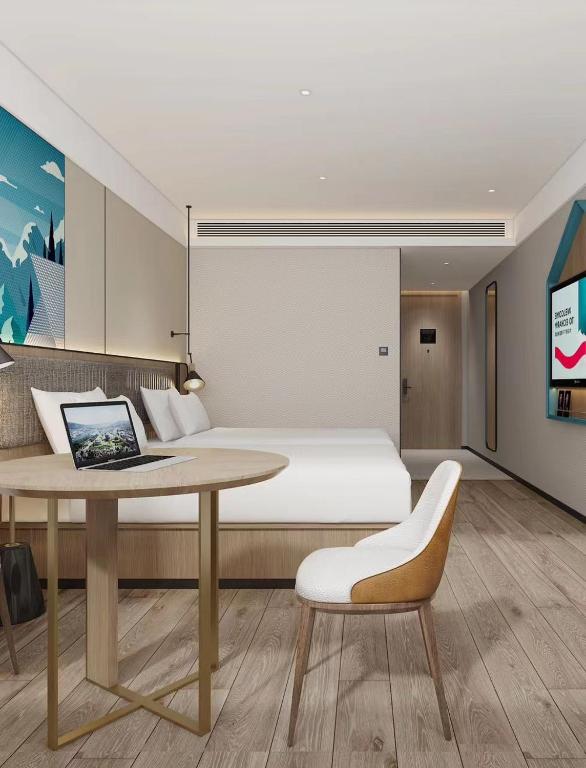 TV a/nebo společenská místnost v ubytování Guangzhou Yilin Hotel - Xiaogang metro Store