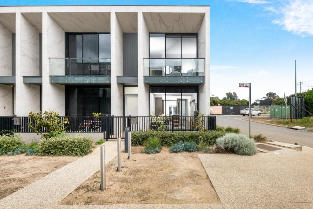 a building with a balcony on the side of it at 3brm townhouse close to Geelong CBD in Geelong West