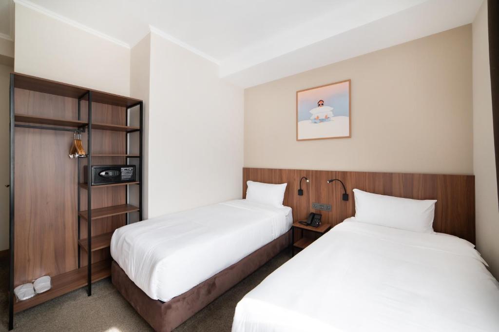 Postel nebo postele na pokoji v ubytování Freedom hotel Bishkek