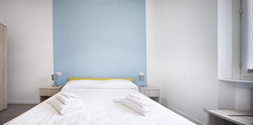 Łóżko lub łóżka w pokoju w obiekcie b&b Amaca