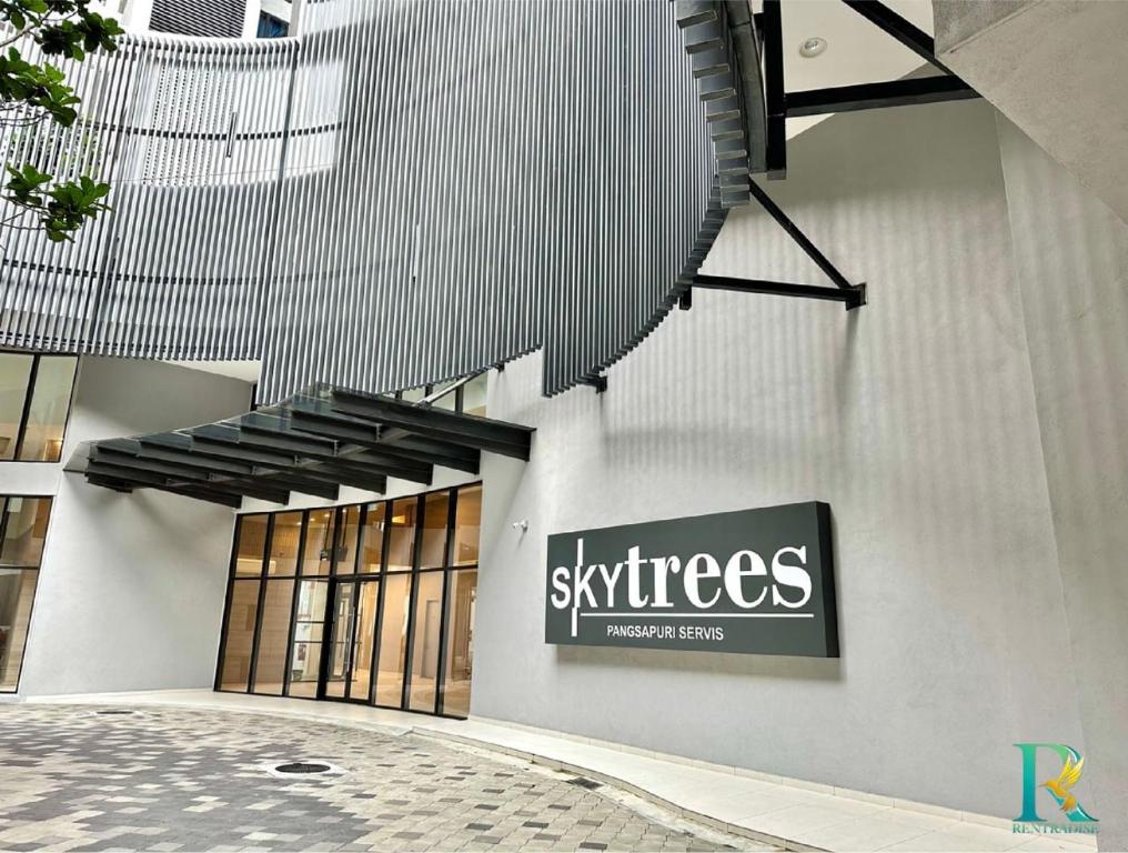 a building with a sign on the side of it at Sky Trees by Rentradise in Johor Bahru