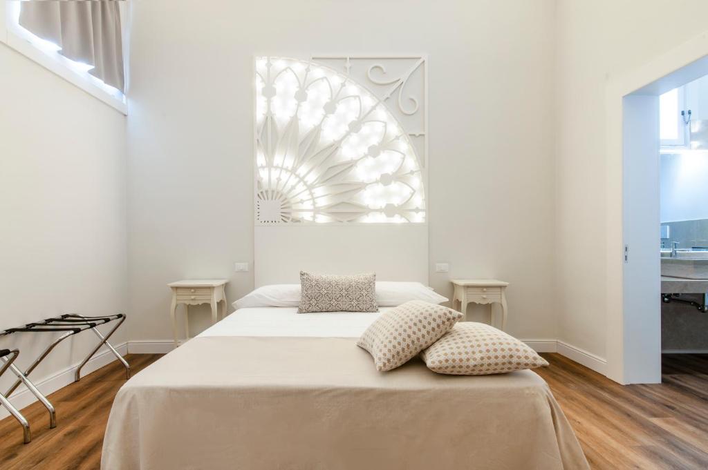 Postel nebo postele na pokoji v ubytování Vittoria Luxury House