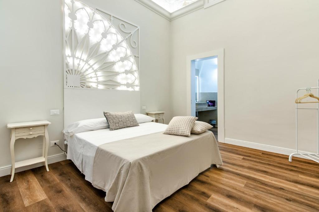 Postel nebo postele na pokoji v ubytování Vittoria Luxury House
