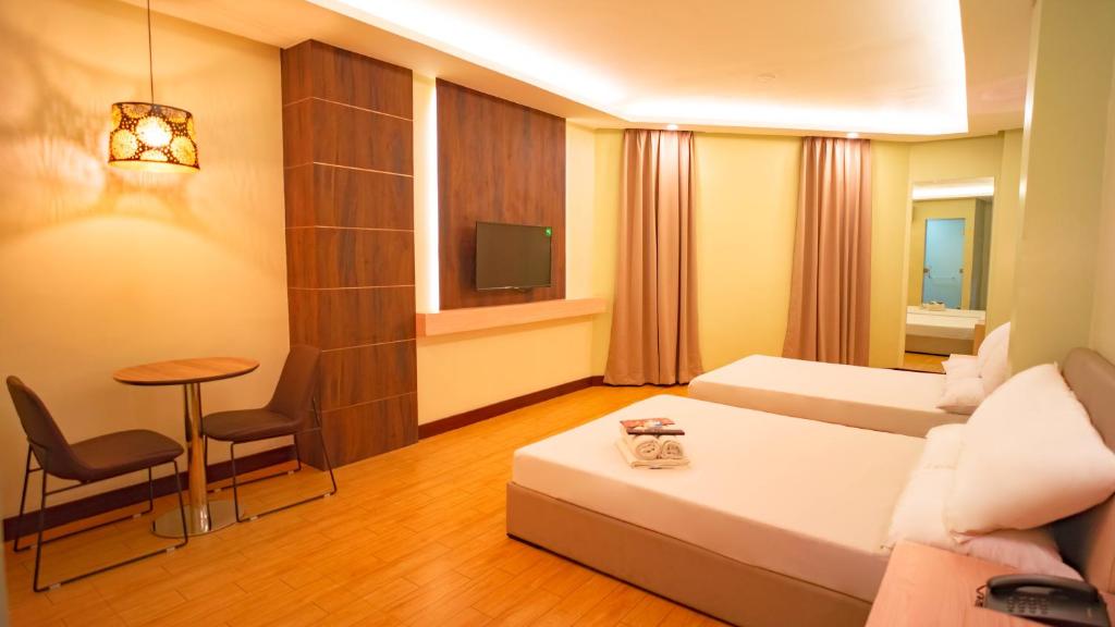 Postel nebo postele na pokoji v ubytování Hotel 99 Quiapo