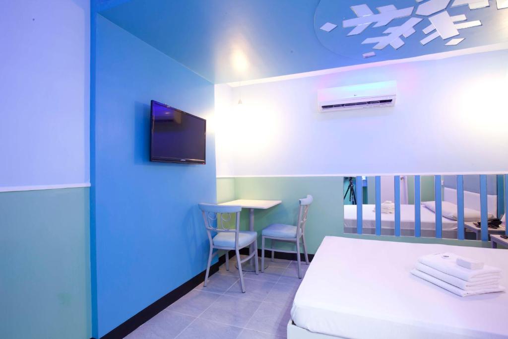 Postel nebo postele na pokoji v ubytování Hotel 99 Quiapo