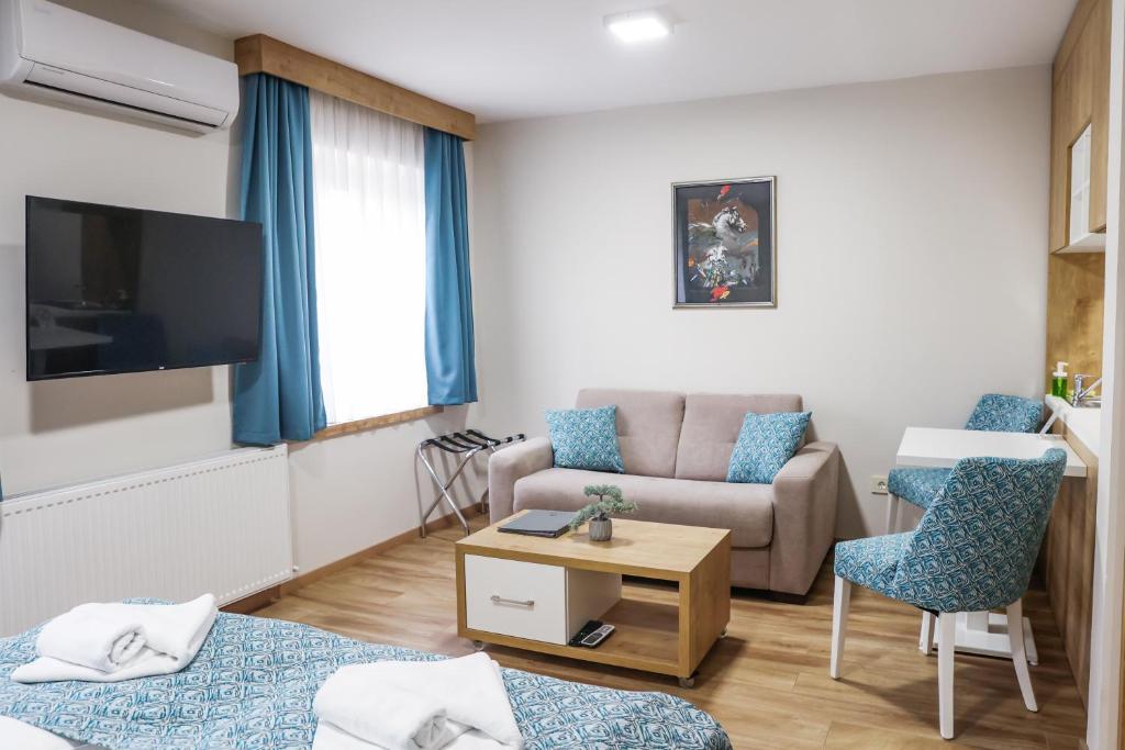 TV a/nebo společenská místnost v ubytování Grand Park rooms & apartments