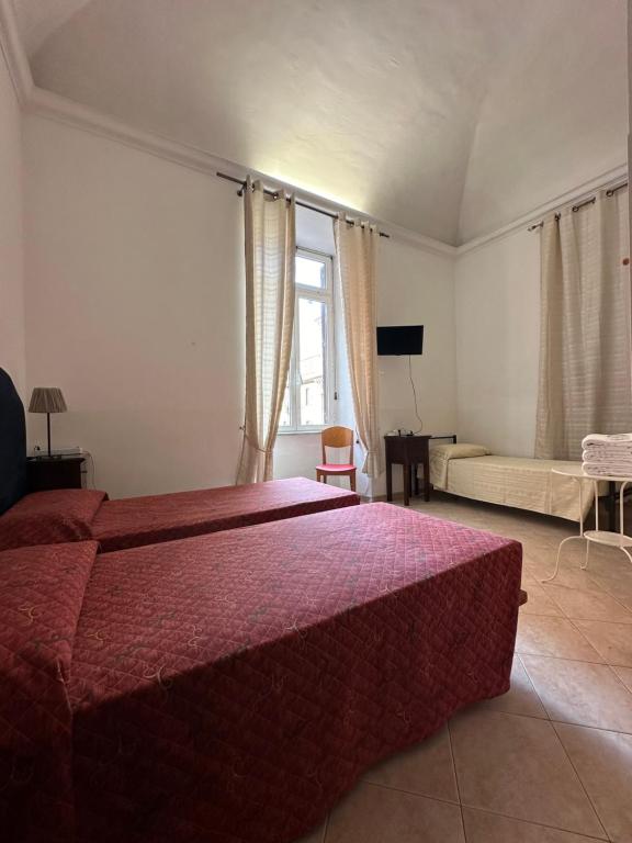 Postel nebo postele na pokoji v ubytování Alloggio Turistico