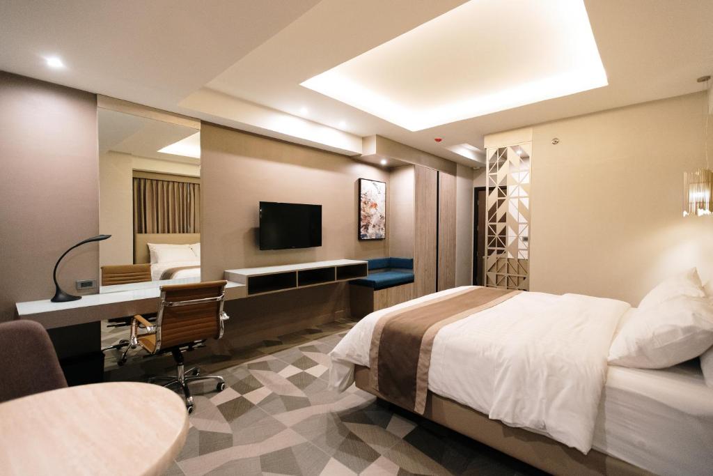 TV a/nebo společenská místnost v ubytování Zuri Hotel
