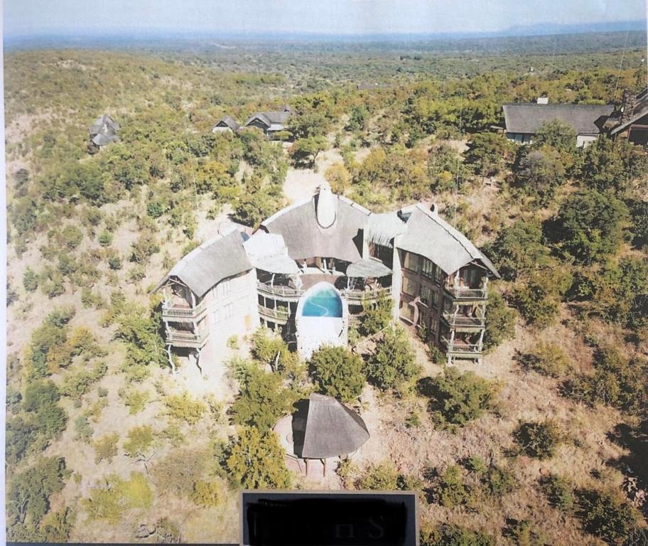 an aerial view of a house with a swimming pool at Reedbuck Lodge @Cyferfontein in Mabalingwe Reserve in Bela-Bela