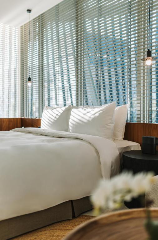 Postel nebo postele na pokoji v ubytování 了了礁溪 Vivir Jiaoxi Hotel
