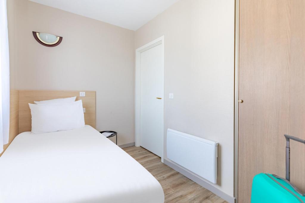 Postel nebo postele na pokoji v ubytování Appart'City Classic Arlon - Porte du Luxembourg