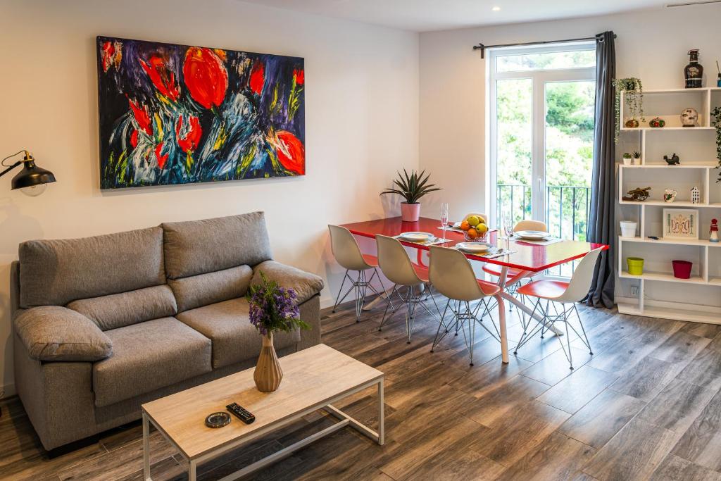 a living room with a couch and a table at Casas 349h Alicante Centre Second Floor in Alicante