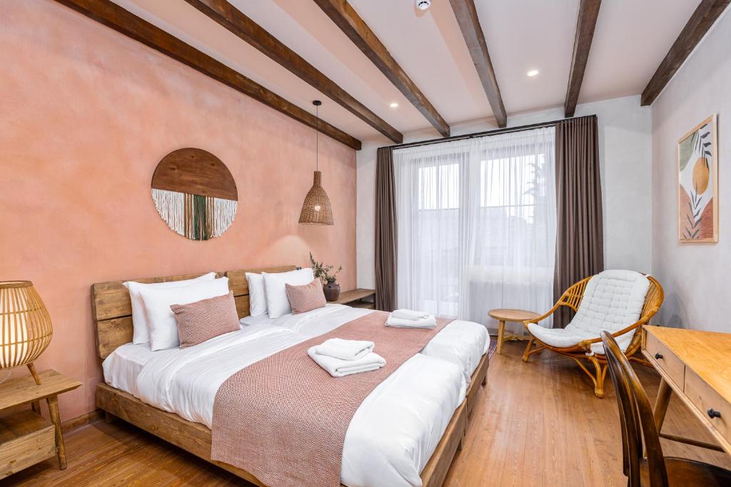 Postel nebo postele na pokoji v ubytování Hameau Mukhrani