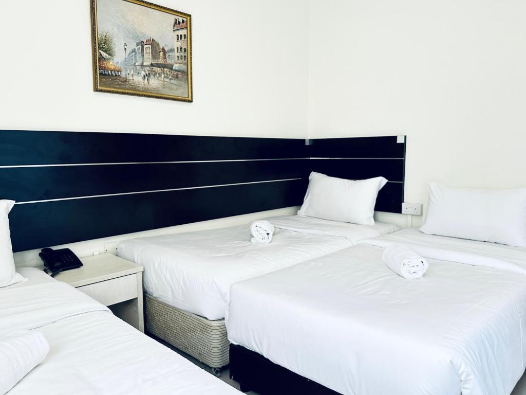 Postel nebo postele na pokoji v ubytování Asphodel Inn