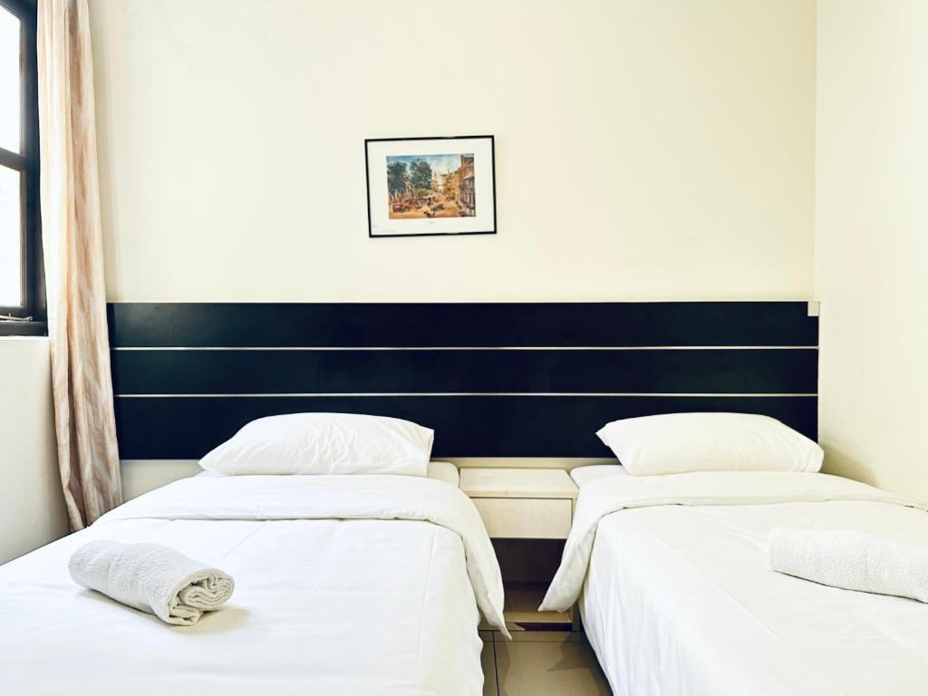 Postel nebo postele na pokoji v ubytování Asphodel Inn