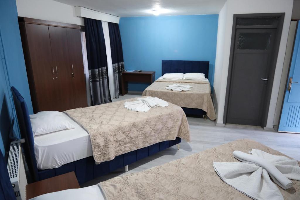 Postel nebo postele na pokoji v ubytování Artemis Yörük Hotel - Pamukkale Denizli