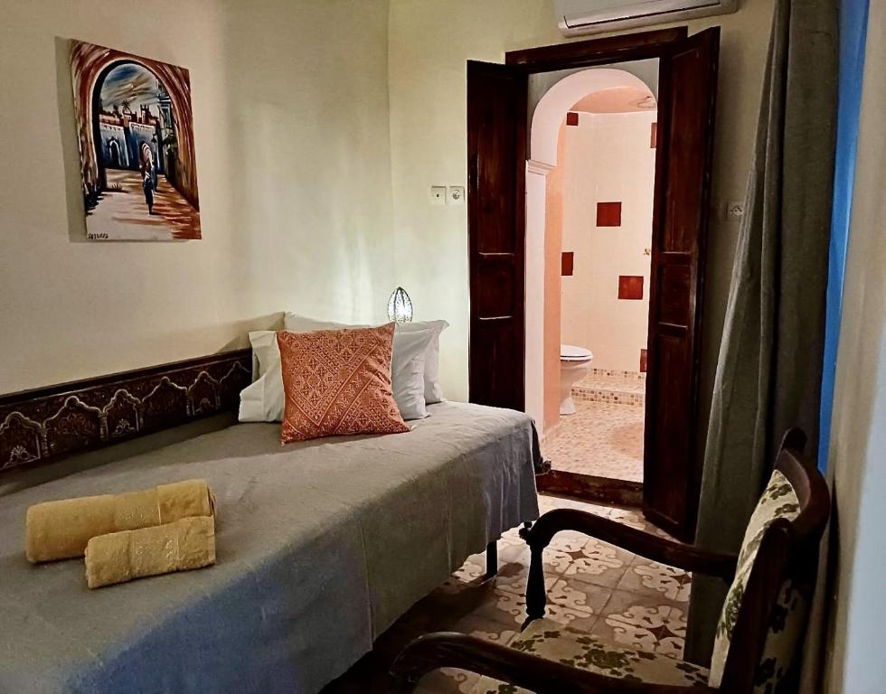 Postel nebo postele na pokoji v ubytování Riad Taghia