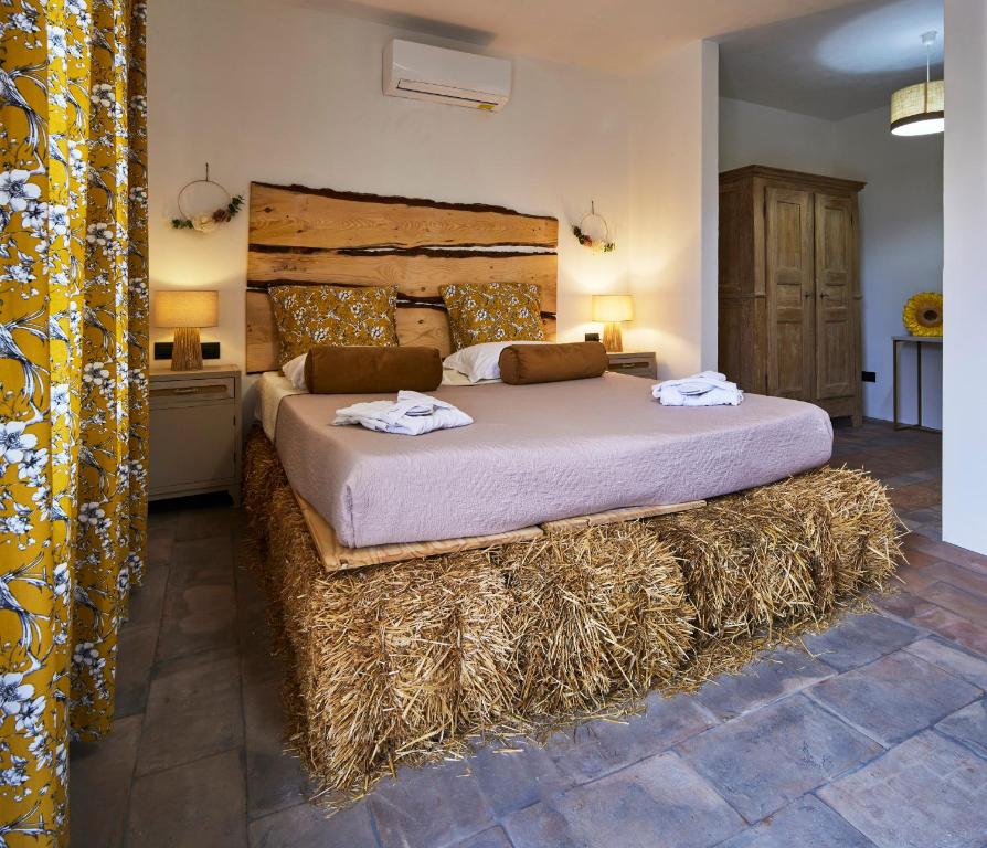 Voodi või voodid majutusasutuse Agriturismo Cascina Mirandola toas