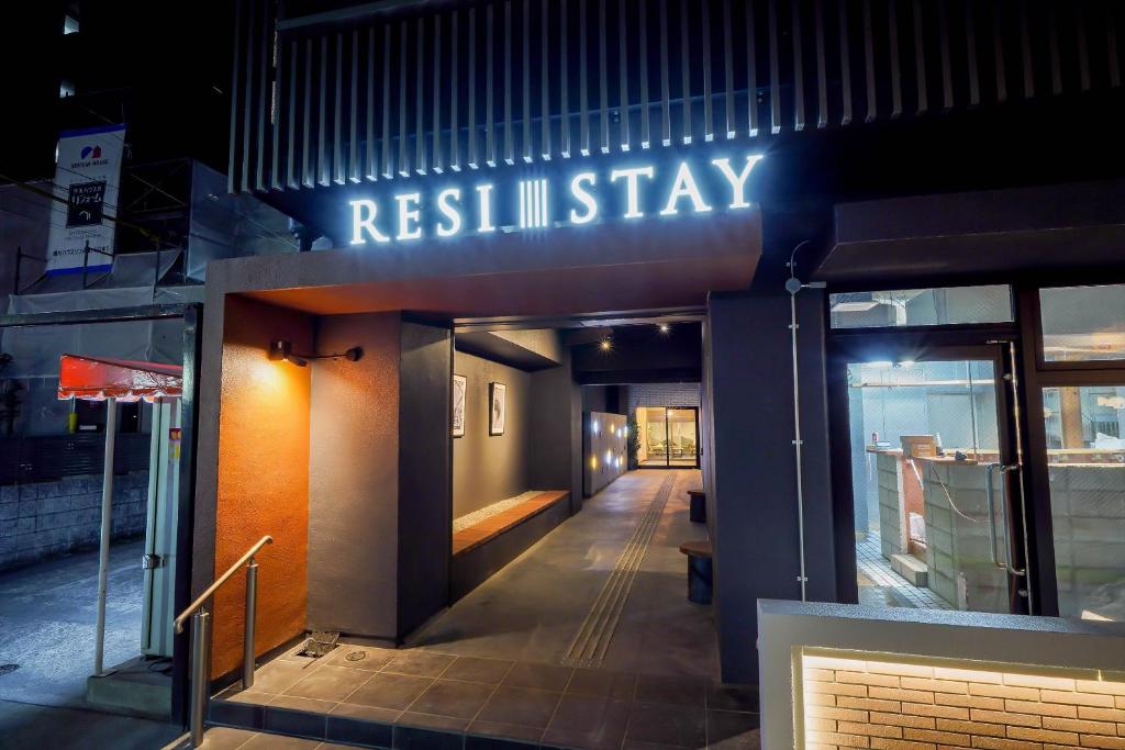 a building with a sign that readsresistin stay at RESI STAY Heart in Kyoto