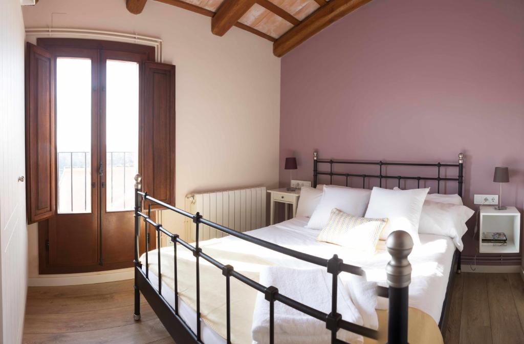 Posteľ alebo postele v izbe v ubytovaní Casa rural Masia Les Apieres