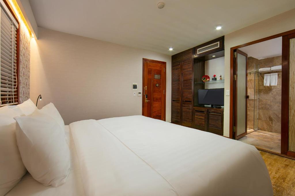 Postel nebo postele na pokoji v ubytování Oriental Suites Hotel & Spa