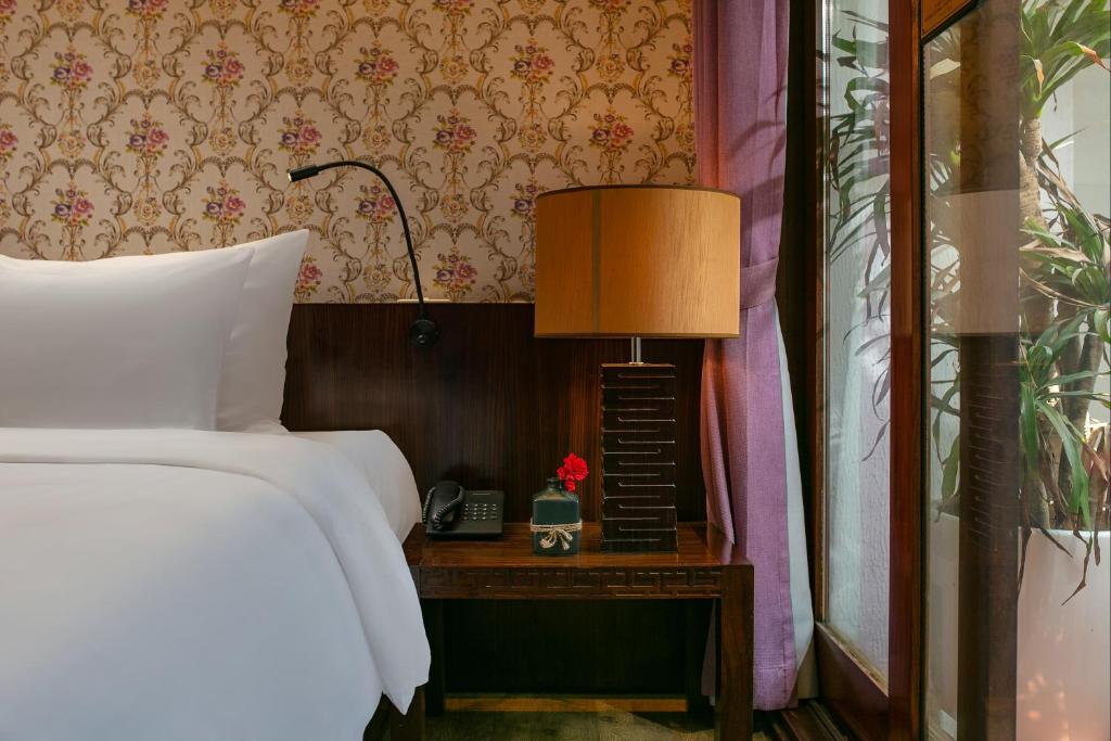 Postel nebo postele na pokoji v ubytování Oriental Suites Hotel & Spa