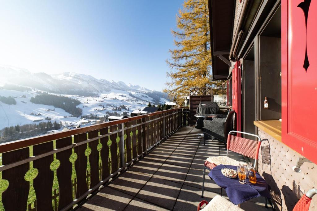 a balcony with a view of a snowy mountain at Steirüti 15 in Wildhaus