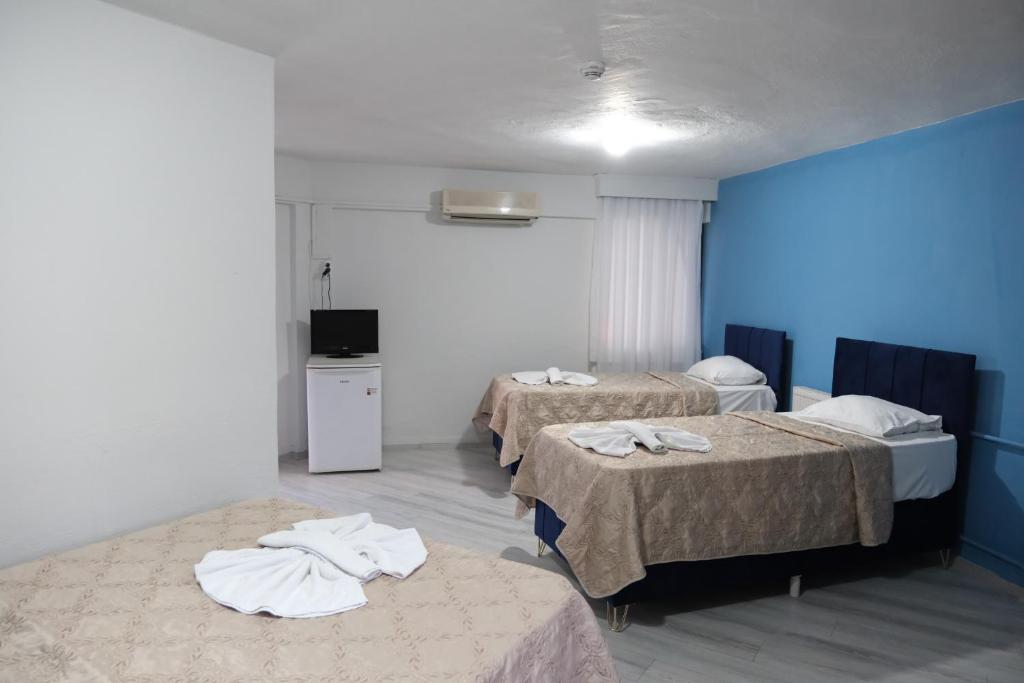 Postel nebo postele na pokoji v ubytování Artemis Yörük Hotel - Pamukkale Denizli